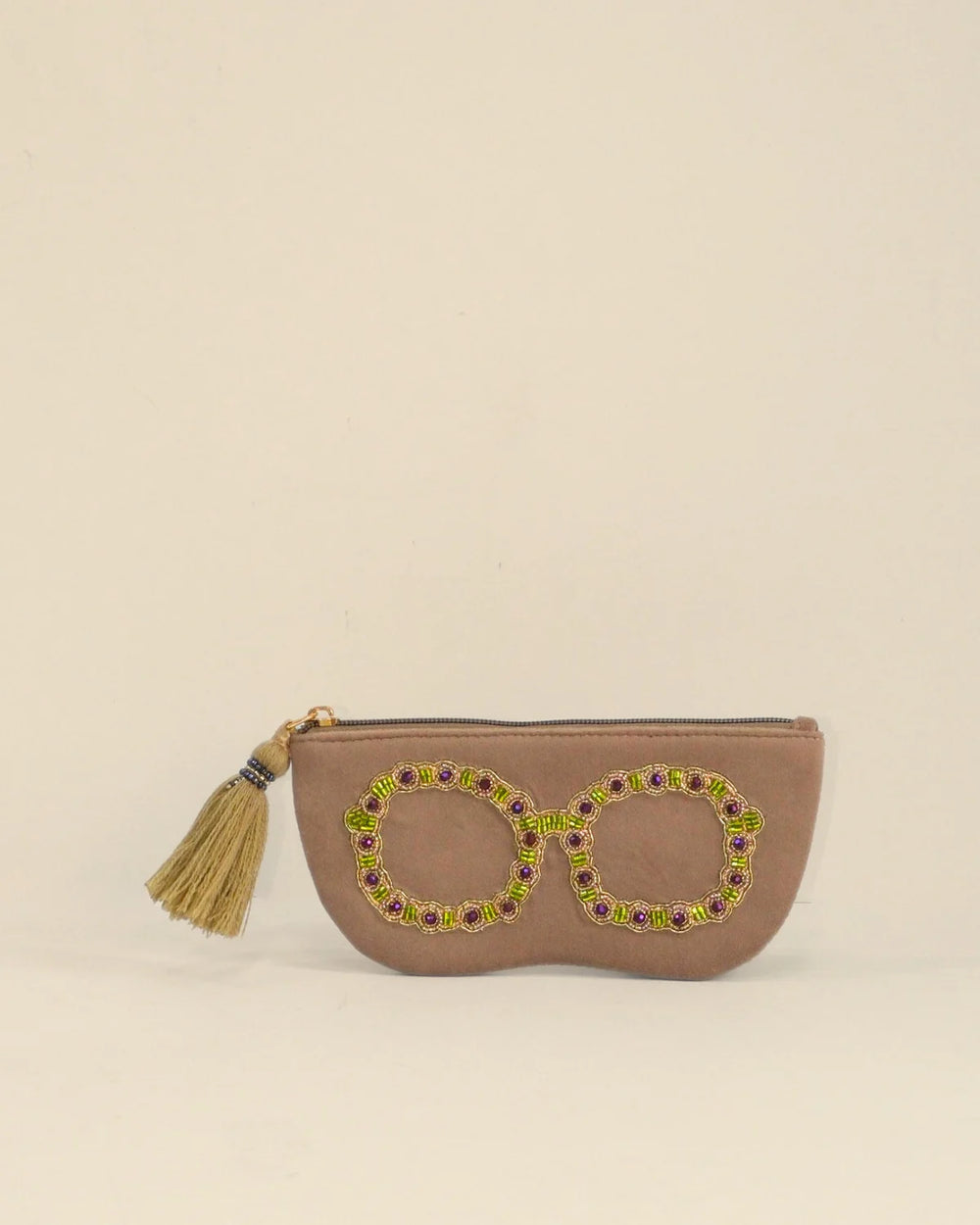 Brown pouch with decorative elements on a beige background
