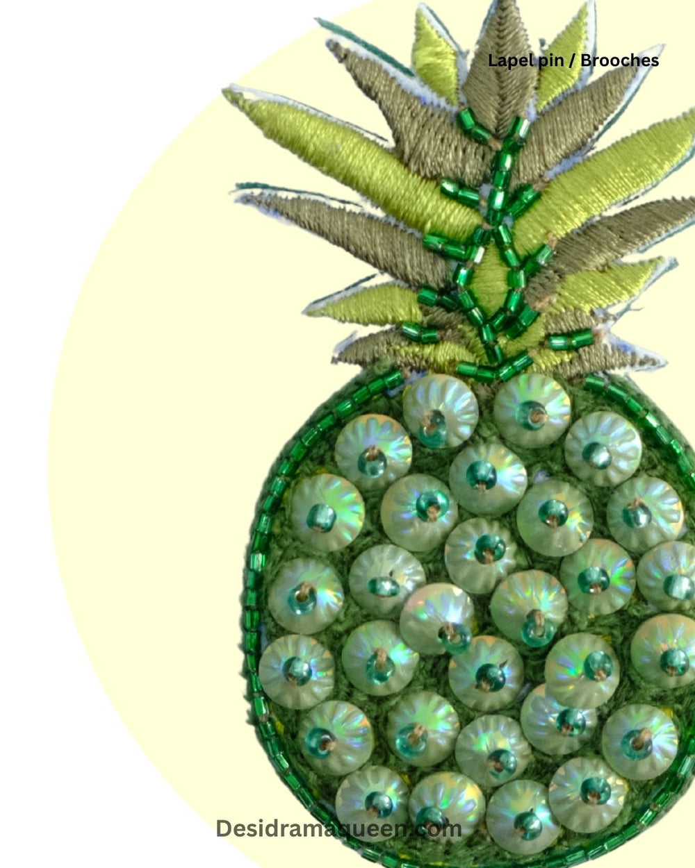 Handmade pineapple brooch with green sequin bead embroidery, quirky fruit lapel pin for jackets, shirts, and bags.