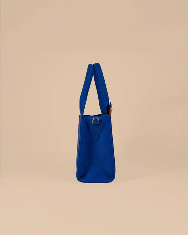 Blue handbag on a beige background