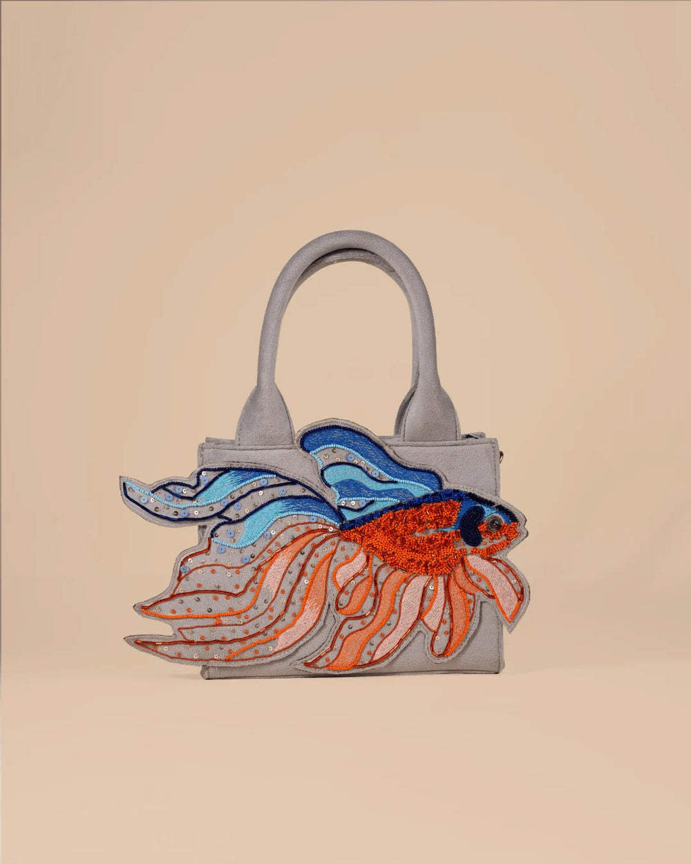 Handbag with a fish design on a beige background