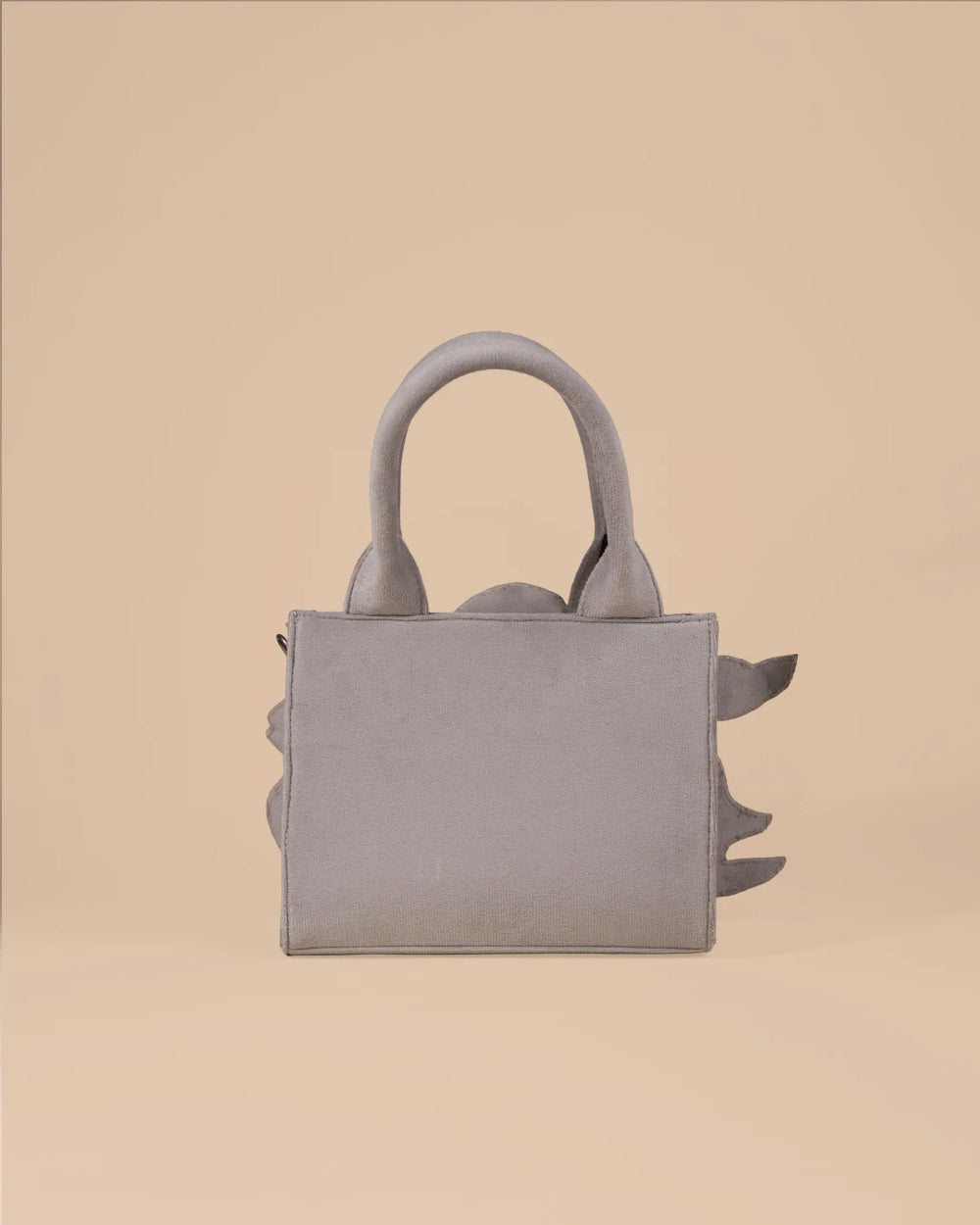 Handbag with a fish design on a beige background
