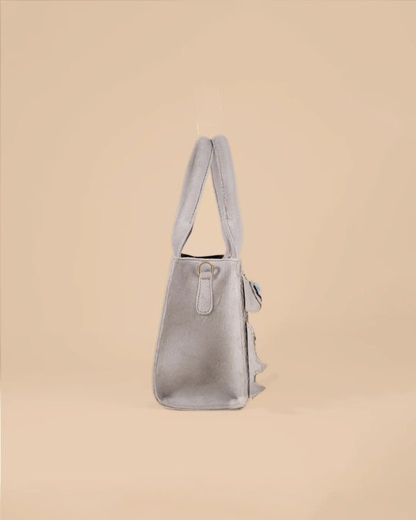 Gray handbag on a beige background