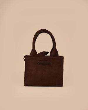 Brown handbag on a beige background