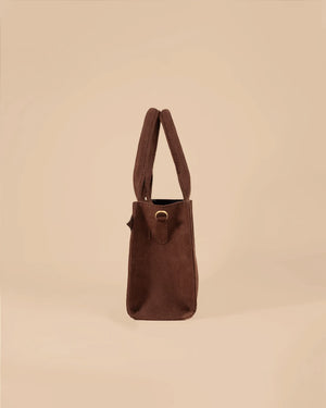 Brown handbag on a beige background