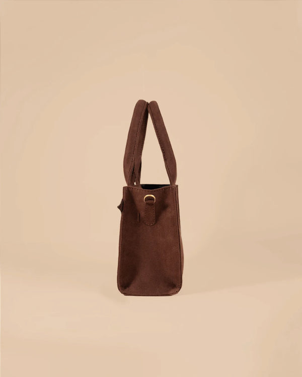 Brown handbag on a beige background